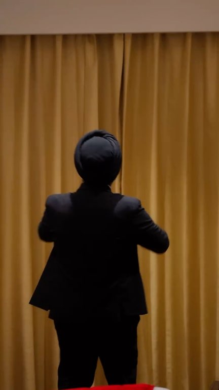 Reel: a room made ready: curtains opened, the sheet smoothed, a red runner laid on the bed