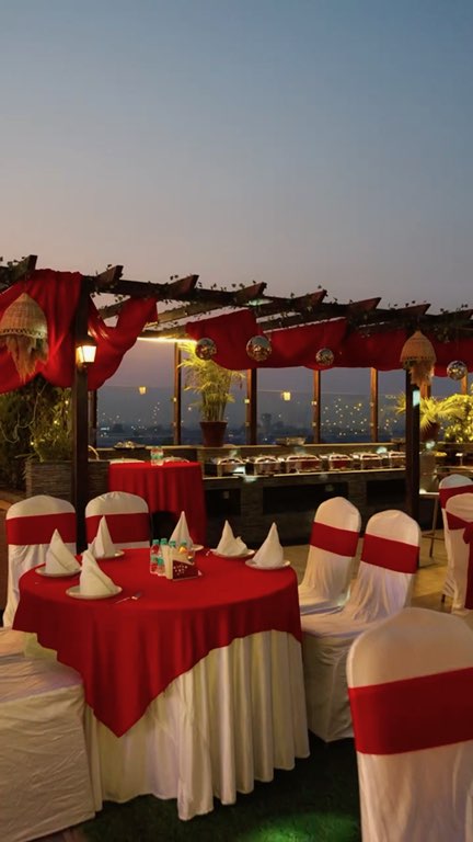 Reel: the rooftop terrace at blue hour, dressed in red for an event