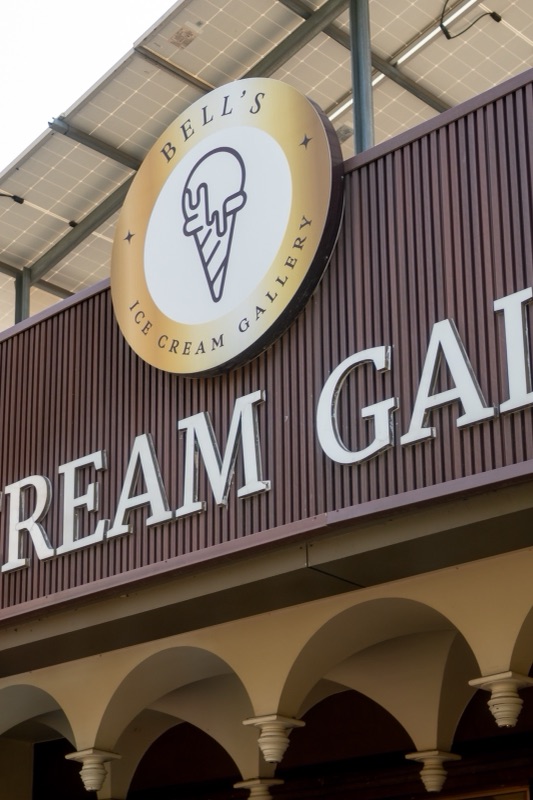 The Bell’s Ice Cream Gallery sign and round logo above the arched shopfront